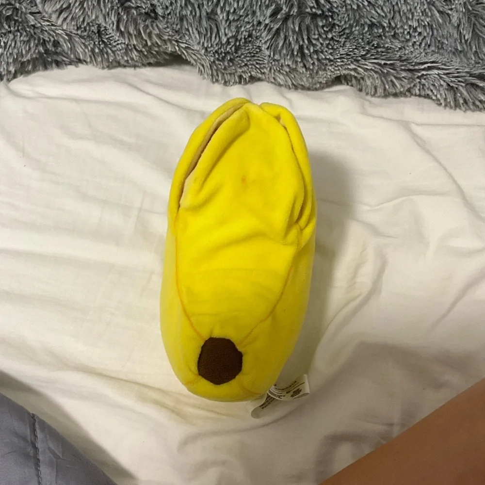 Open and close Velcro banana cat stuffy.